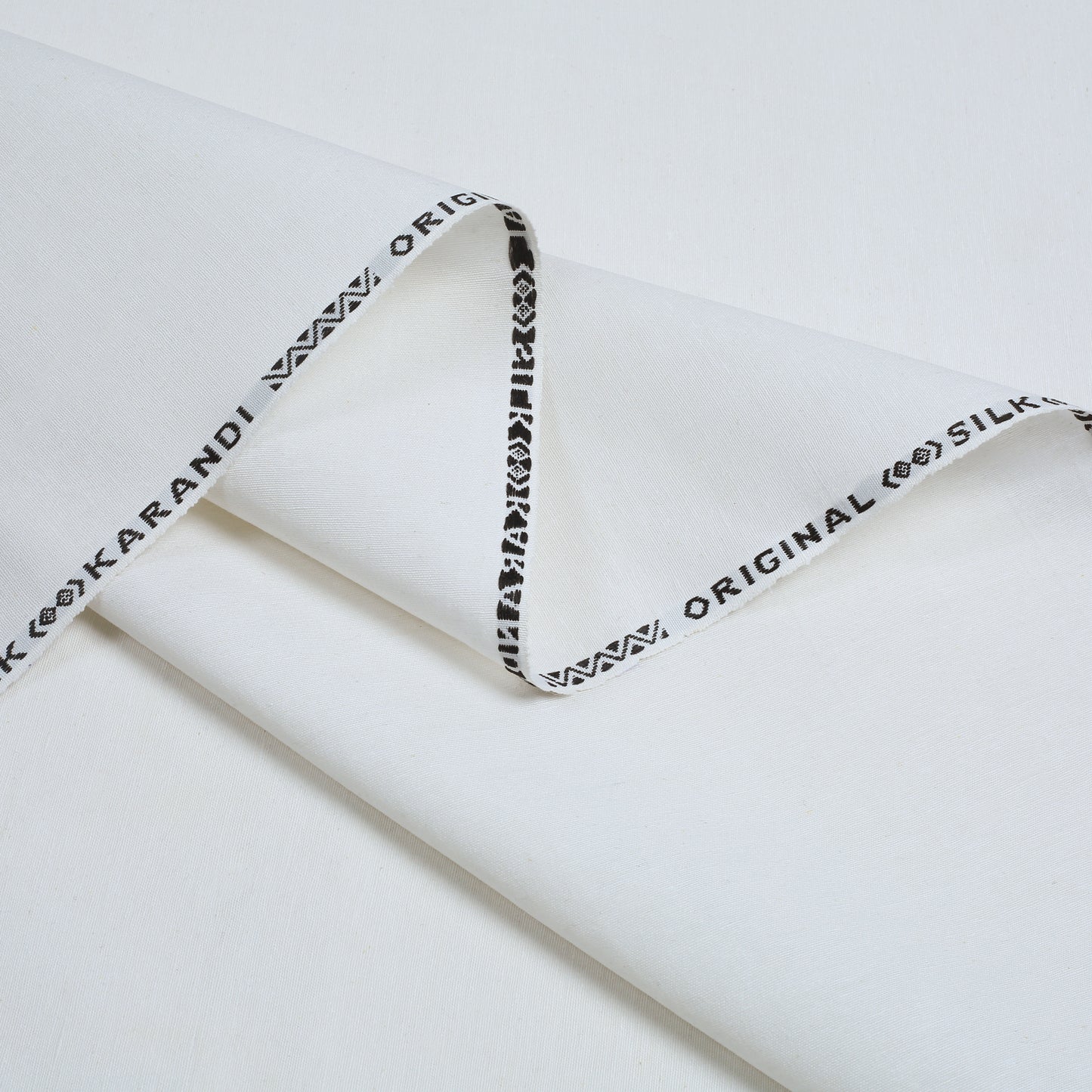 White fabric with black text on a white background