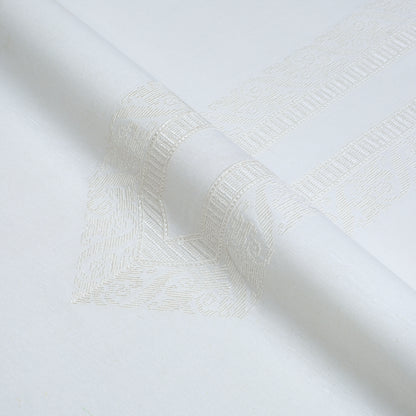 Close-up of textured white fabric with a subtle pattern